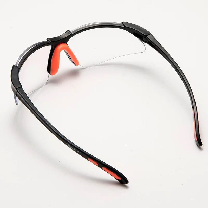 Transparent safety goggles for cycling and lab work, providing eye protection and security, with a clear protective design.