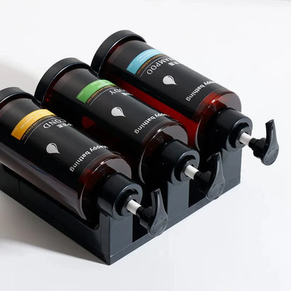 Wall-mounted hotel shampoo and shower gel bottles with manual soap dispensers and hand sanitizer boxes, no punching needed.