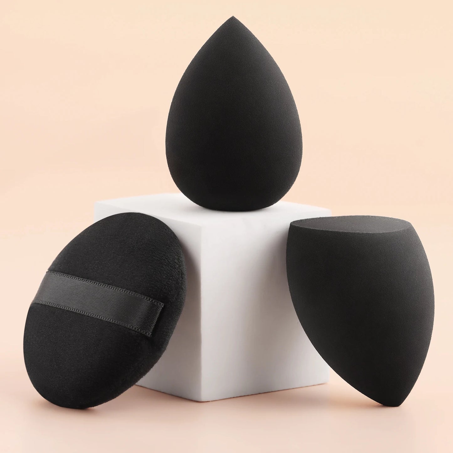 8-piece black long tube face and eye brush set with 2 beauty sponges, powder, blush, and eyeshadow brushes for makeup application
