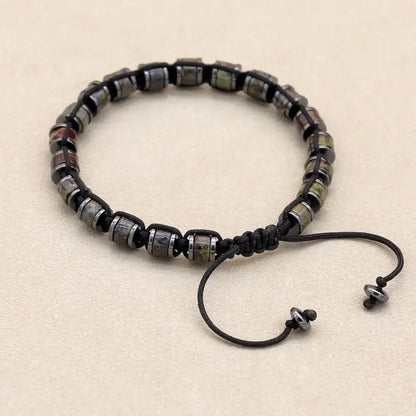 Men's and women's braided bracelet with natural hematite, dragon blood beads, and unakite stones, handcrafted health jewelry.