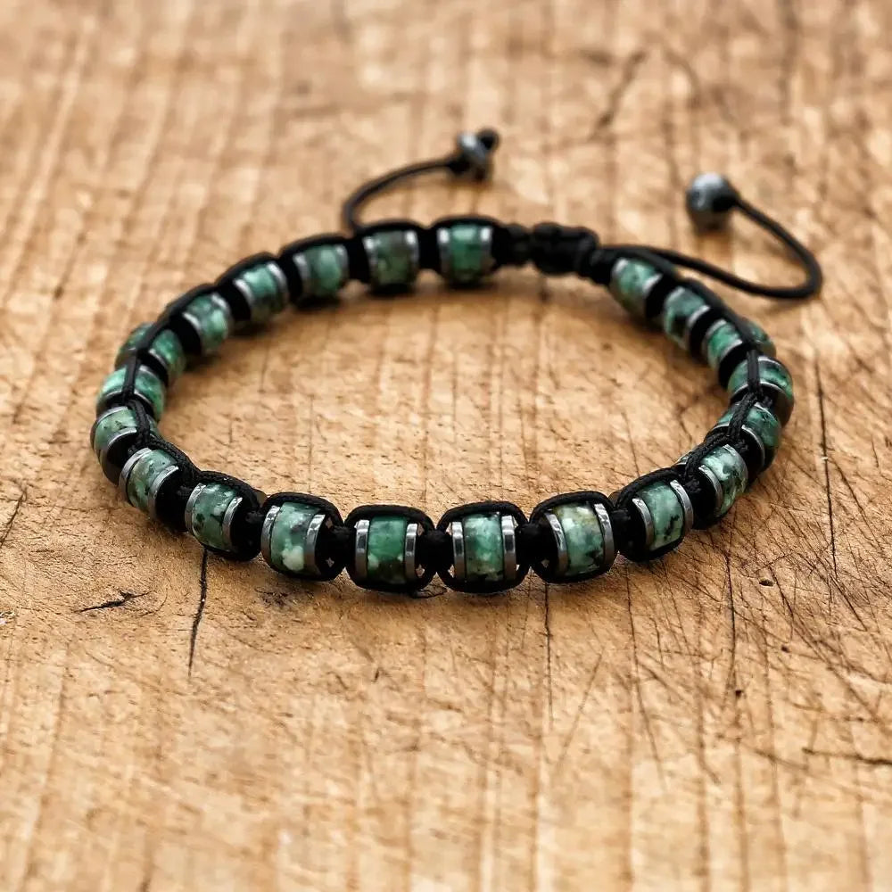 Men's and women's braided bracelet with natural hematite, dragon blood beads, and unakite stones, handcrafted health jewelry.