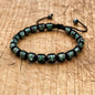 Men's and women's braided bracelet with natural hematite, dragon blood beads, and unakite stones, handcrafted health jewelry.