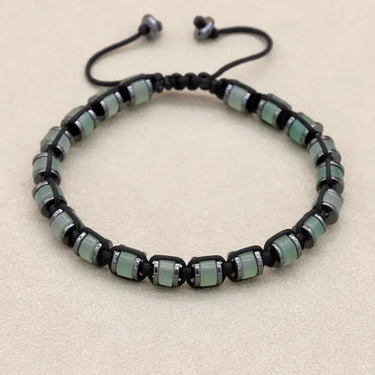Men's and women's braided bracelet with natural hematite and dragon blood stone beads, handmade health jewelry for couples.