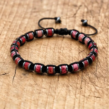 Men's and women's braided bracelet with natural hematite, dragon blood beads, and unakite stones, handmade health jewelry for couples.