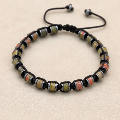 Men's and women's braided bracelet featuring natural hematite, dragon blood beads, and unakite stones, handmade jewelry for health and style.