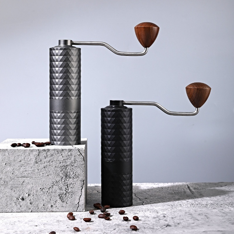 Black manual coffee grinder by BACKUPMYFILESNOW.COM® with a sleek design and adjustable grind settings.