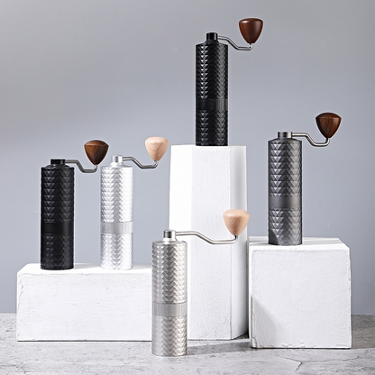 Black manual coffee grinder from BACKUPMYFILESNOW.COM® with a compact design and a hand crank for fresh coffee grounds.