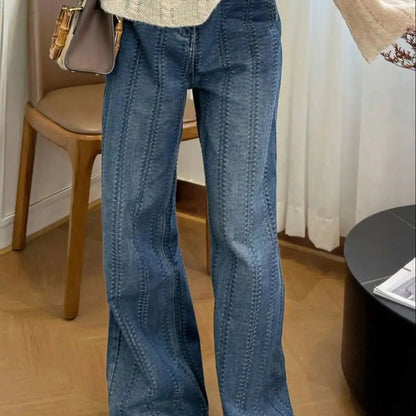 Blue high-waist wide-leg jeans for women, crafted with heavy denim, straight-leg style, in a vintage look.