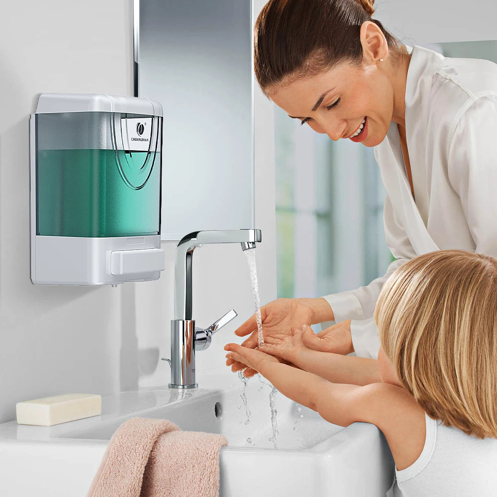 White wall-mounted soap dispenser by BackupMyFilesNow.com, designed for liquid soap, hand gel, and sanitizer in bathroom or kitchen.