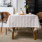 White cotton linen boho farmhouse tablecloth with burlap stripes, washable rectangle table cover for kitchen or picnic use.