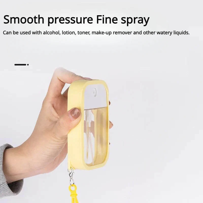 Small 50ml scented vegan hand sanitizer spray with keychain, alcohol water disinfectant, ideal for travel and on-the-go use.