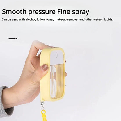 Small 50ml scented vegan hand sanitizer spray with keychain, alcohol water disinfectant, ideal for travel and on-the-go use.