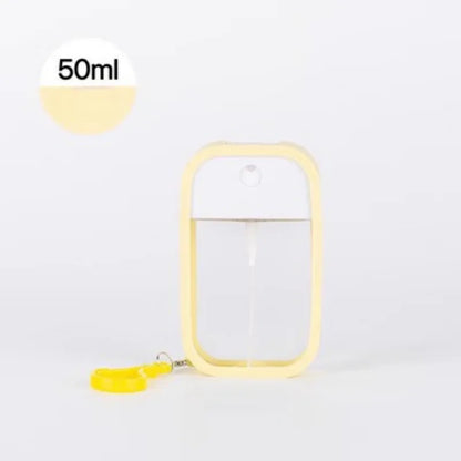 White 50ml scented vegan hand sanitizer spray bottle with keychain, compact travel disinfectant and perfume dispenser.