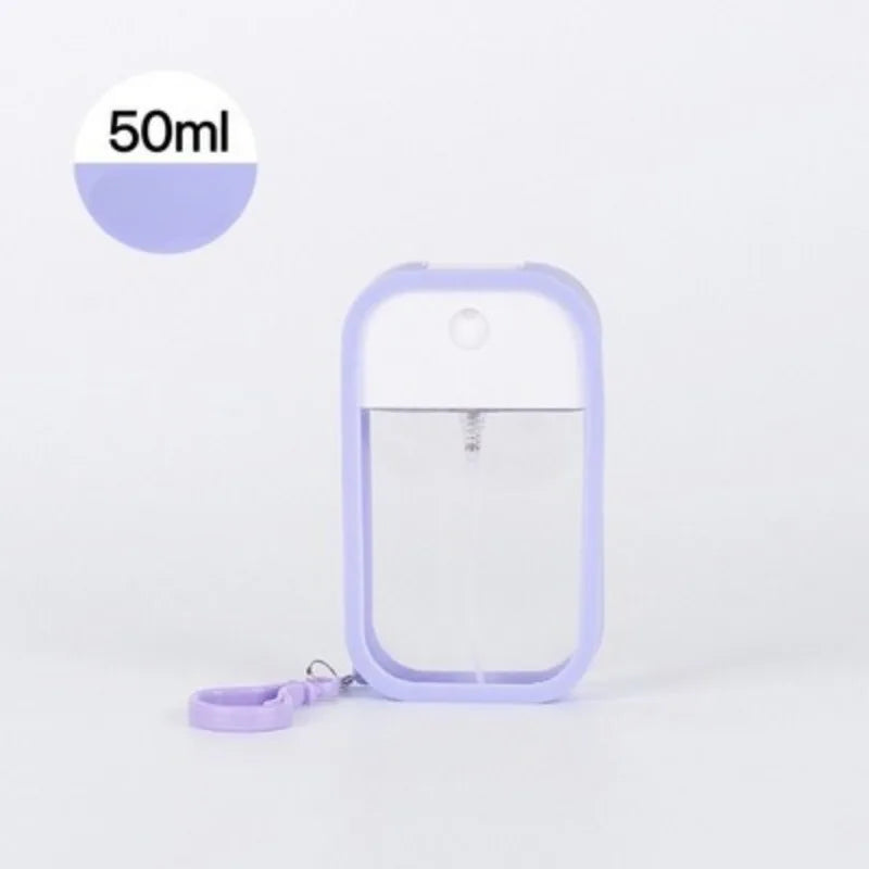 White 50ml vegan hand sanitizer spray with keychain, scented alcohol water dispenser for travel and personal use.