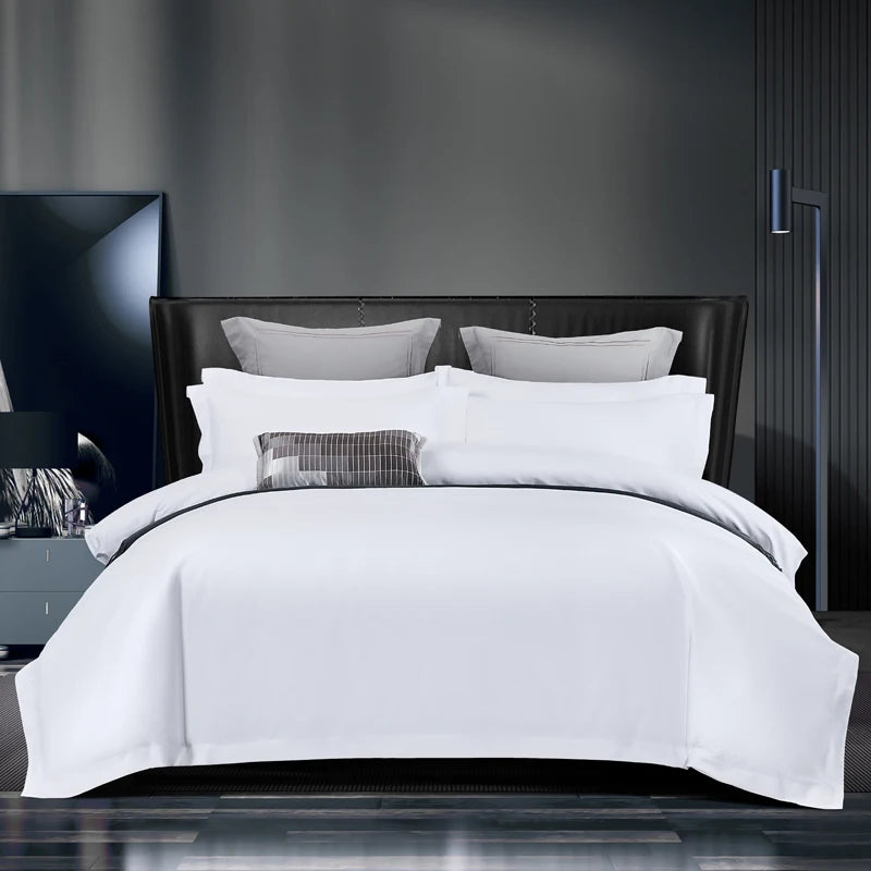 White bedding set with duvet cover, sheet, and pillowcases in queen and king sizes, designed for 5-star hotel style comfort.