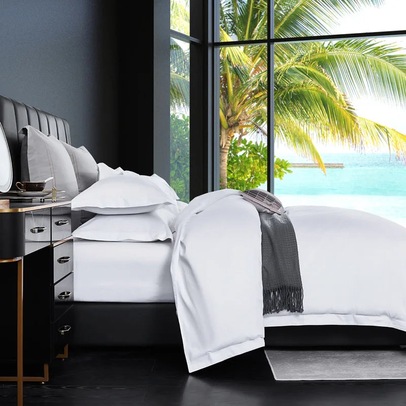 White bedding set with duvet cover, sheets, and pillowcases in queen and king sizes, designed for luxury hotel-style home bedding.