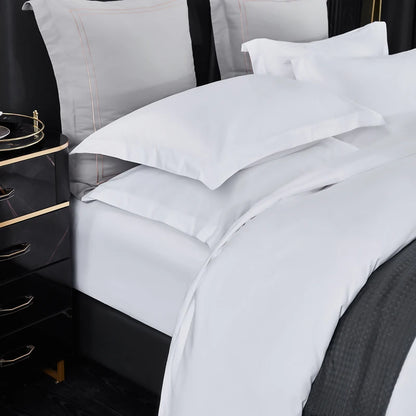 White bedding set for double, queen, and king beds featuring duvet cover, sheets, and pillowcases, designed for luxury hotel style.