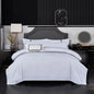 White hotel-style bedding set with duvet cover, sheets, and pillowcases in double, queen, and king sizes, styled on a bed.