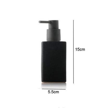 White ceramic bathroom soap and lotion bottles, square-shaped hand sanitizer and liquid containers with press-top lids for bathroom accessories.