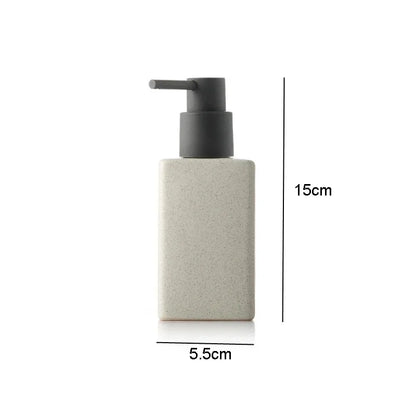 White ceramic bathroom supplies hand sanitizer and lotion bottles, square-shaped soap liquid container with press top.