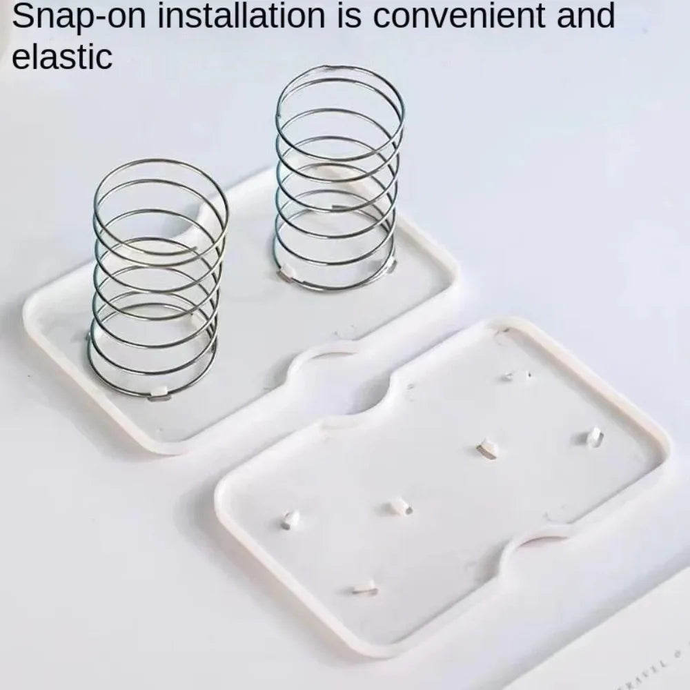 White plastic paper towel spring pallet with high elasticity and double springs for tissue box bottom, practical and durable.