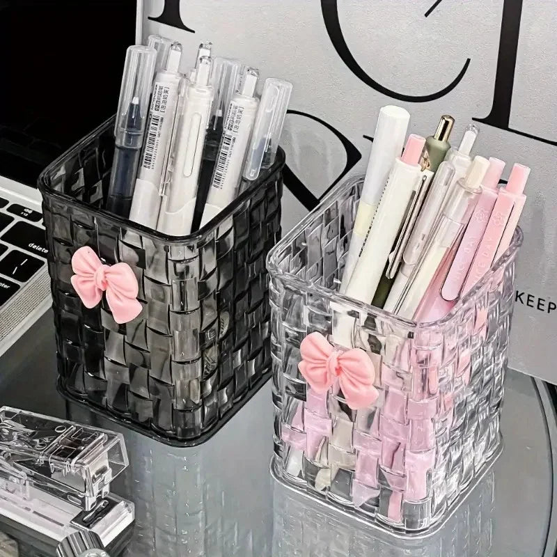 Clear acrylic desk organizer with bow accent, PMMA pen holder, and storage basket for office supplies and accessories.