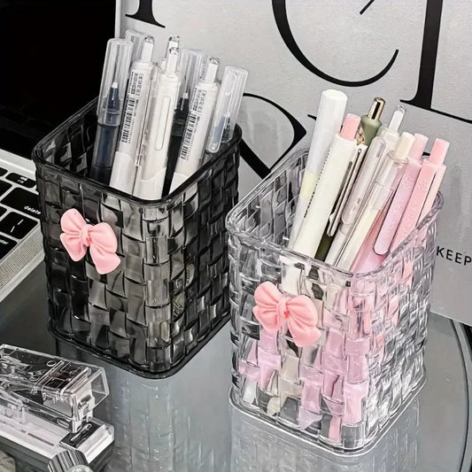 Clear acrylic desk organizer with bow accent, PMMA pen holder, and storage basket for office supplies and accessories.