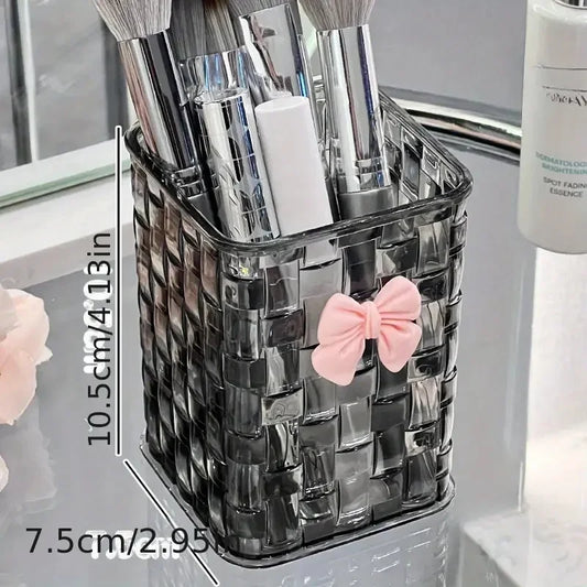 Clear acrylic desk organizer with bow accent, PMMA pen holder, and storage basket for office supplies and accessories.