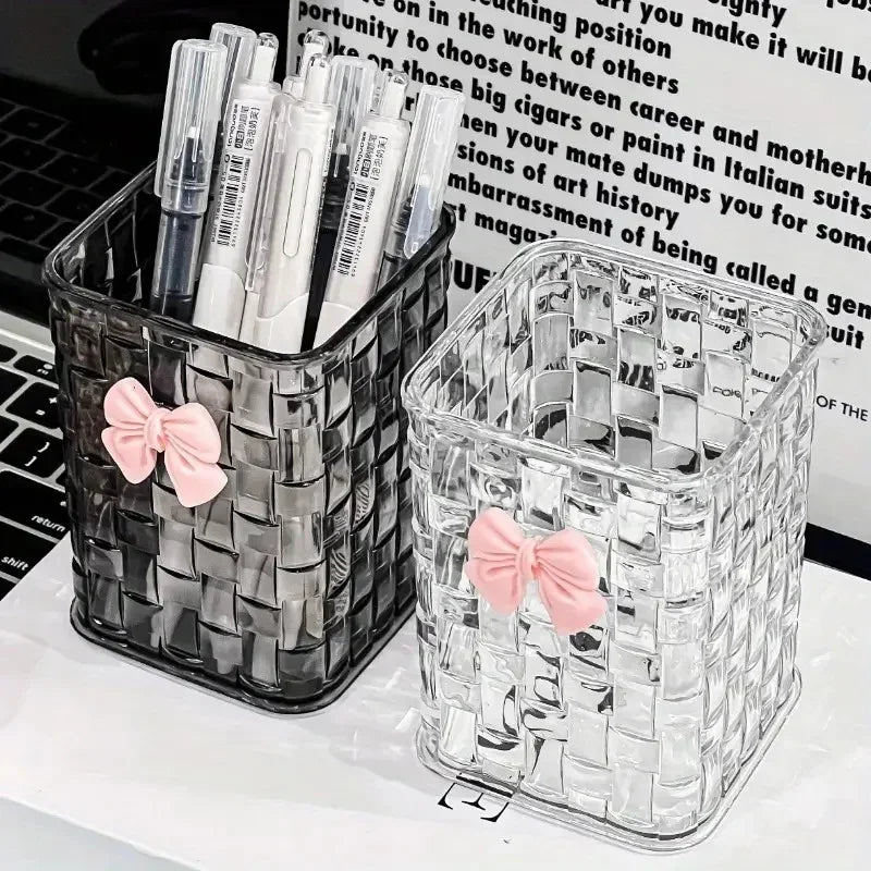 Clear acrylic desk organizer with bow accent, PMMA pen holder, and storage basket for office supplies and accessories.