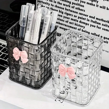 Clear acrylic desk organizer with bow accent, PMMA pen holder, and storage basket for office supplies and accessories.