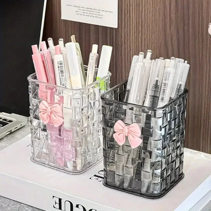 Clear acrylic desk organizer with bow accent, PMMA pen holder, and storage basket for office supplies and accessories.