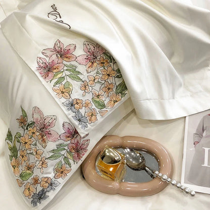 Luxury floral embroidery bedding set with white Egyptian cotton quilt, duvet cover, fitted sheet, mattress cover, and pillowcases.