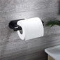 White kitchen paper towel holder with adhesive tissue hanger and toilet roll dispenser mounted on a bathroom cabinet.