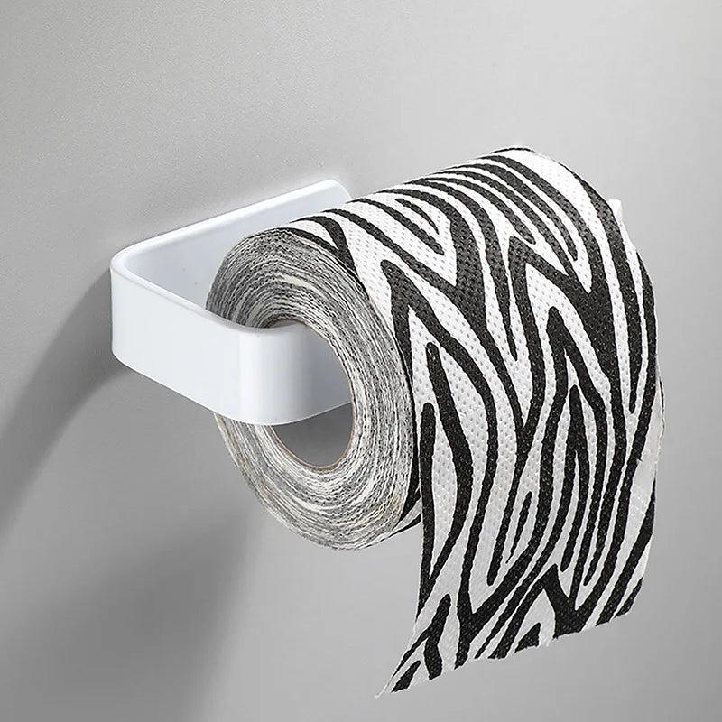 White kitchen paper towel holder with adhesive tissue hanger and toilet roll dispenser, mounted on bathroom or cabinet wall.