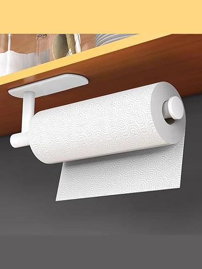 White kitchen paper towel holder with adhesive tissue hanger and toilet roll dispenser, mounted on a bathroom cabinet.
