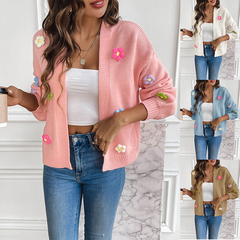 White knitted women's cardigan with floral design, featuring a cozy, stylish sweater coat from BackupMyFilesNow.com