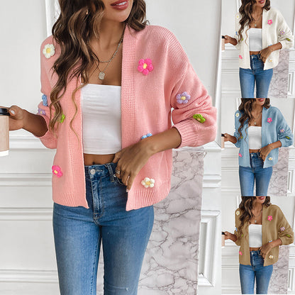 White knitted women's cardigan with floral design, featuring a cozy, stylish sweater coat from BackupMyFilesNow.com