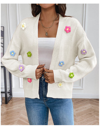 White knitted women's cardigan with floral design, featuring a cozy, stylish sweater coat from BackupMyFilesNow.