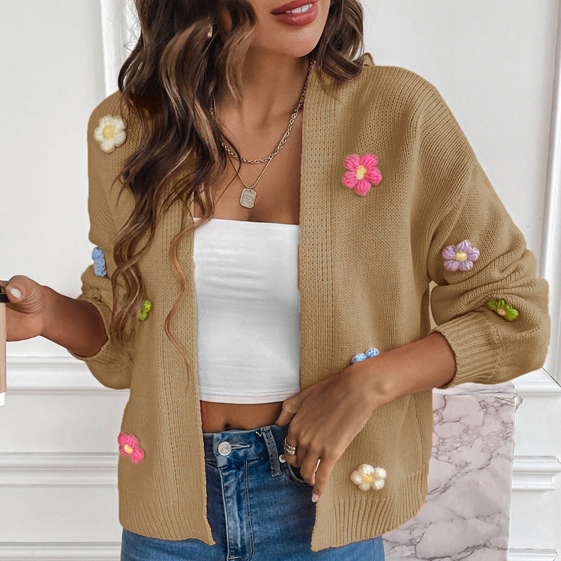 White knitted women's cardigan with floral design, cozy sweater coat from BackupMyFilesNow.com.