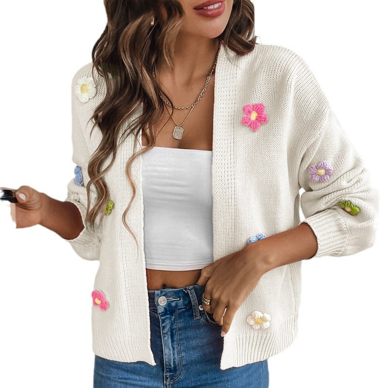 White knitted women's cardigan with floral design, featuring a cozy sweater coat style from BackupMyFilesNow.com