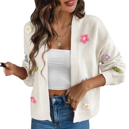 White knitted women's cardigan with floral design, featuring a cozy sweater coat style from BackupMyFilesNow.com
