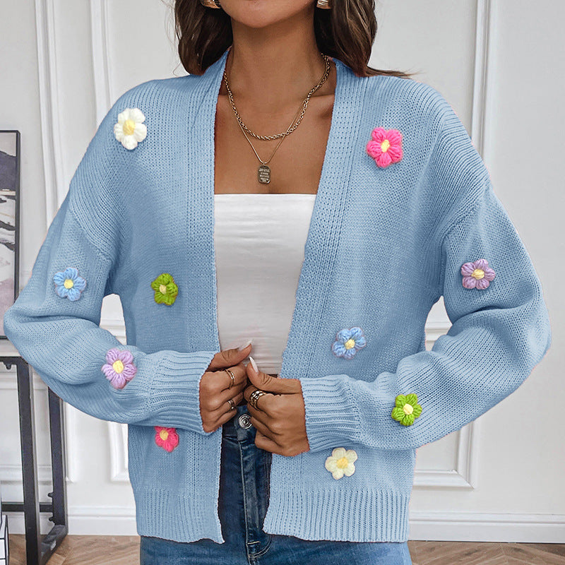 White knitted cardigan for women with floral design, cozy sweater coat from BackupMyFilesNow.com.