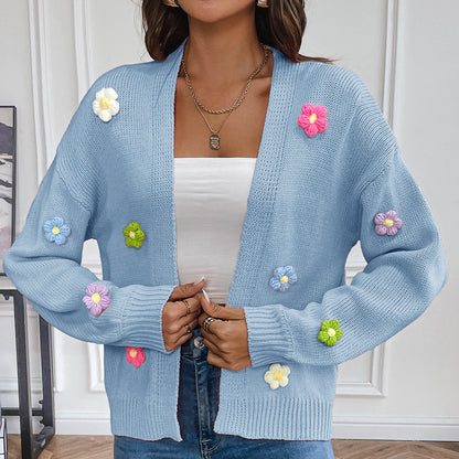 White knitted cardigan for women with floral design, cozy sweater coat from BackupMyFilesNow.com.