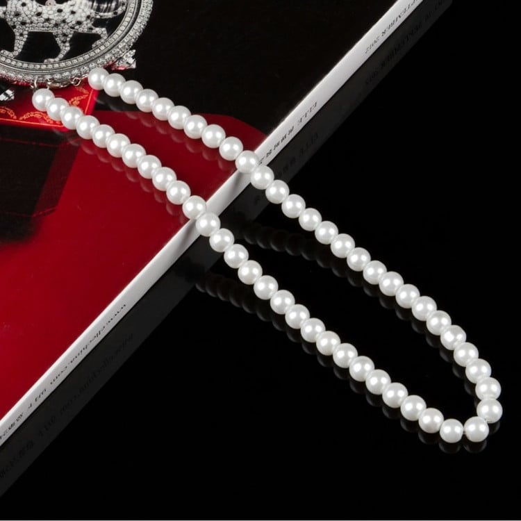 Natural freshwater pearl necklace featuring white pearls, elegant jewelry piece with a delicate clasp, perfect for sophisticated styles.