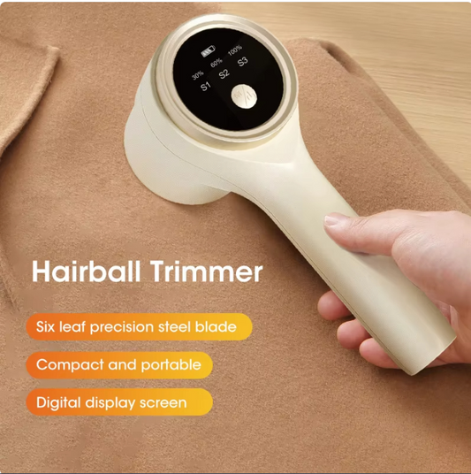 White rechargeable fabric and lint shaver with ergonomic handle for removing lint and fuzz from clothing and upholstery.