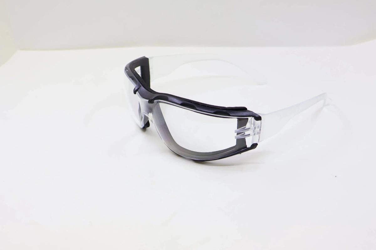 White safety goggles with soft foam gasket and clear lenses for sports, shooting, woodworking, lab, industry, and outdoor protection.