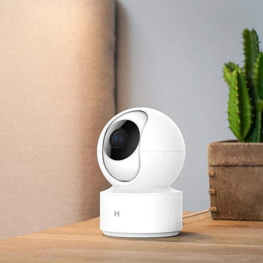 White BackupMyFilesNow.com smart security camera with sleek design, mounted on a wall for home surveillance.