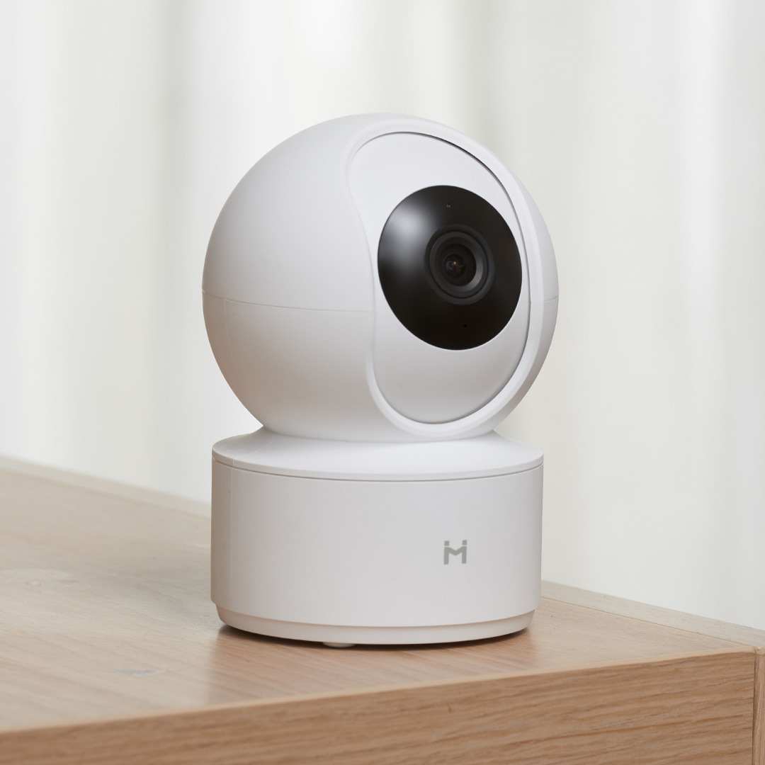 White BackupMyFilesNow.com smart security camera with adjustable mount and lens for home surveillance and security.