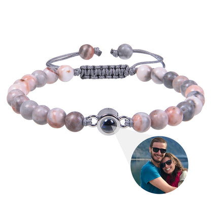 White turquoise custom photo projection bracelet by BackupMyFilesNow.com featuring engravings in 100 languages.