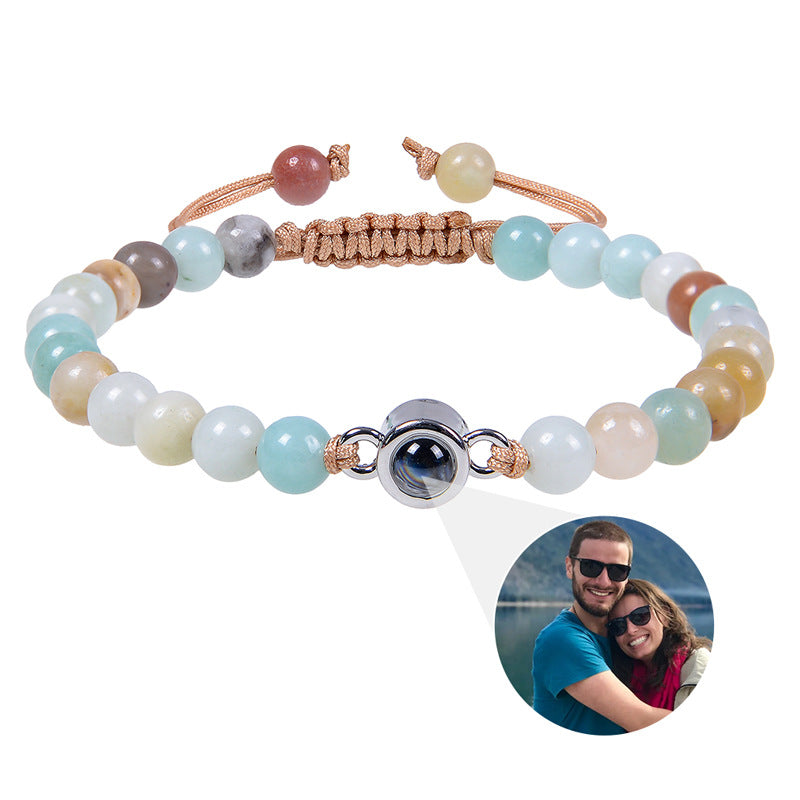 White turquoise custom photo projection bracelet by BackupMyFilesNow.com featuring engravings in 100 languages.